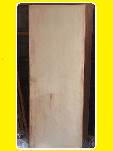A SOLID CORE DOOR IN OUR WORKSHOP READY TO HAVE PANELS AND HARDWOOD EDGINGS FITTED AND THEN WILL BE PRIMED FOR FITTING